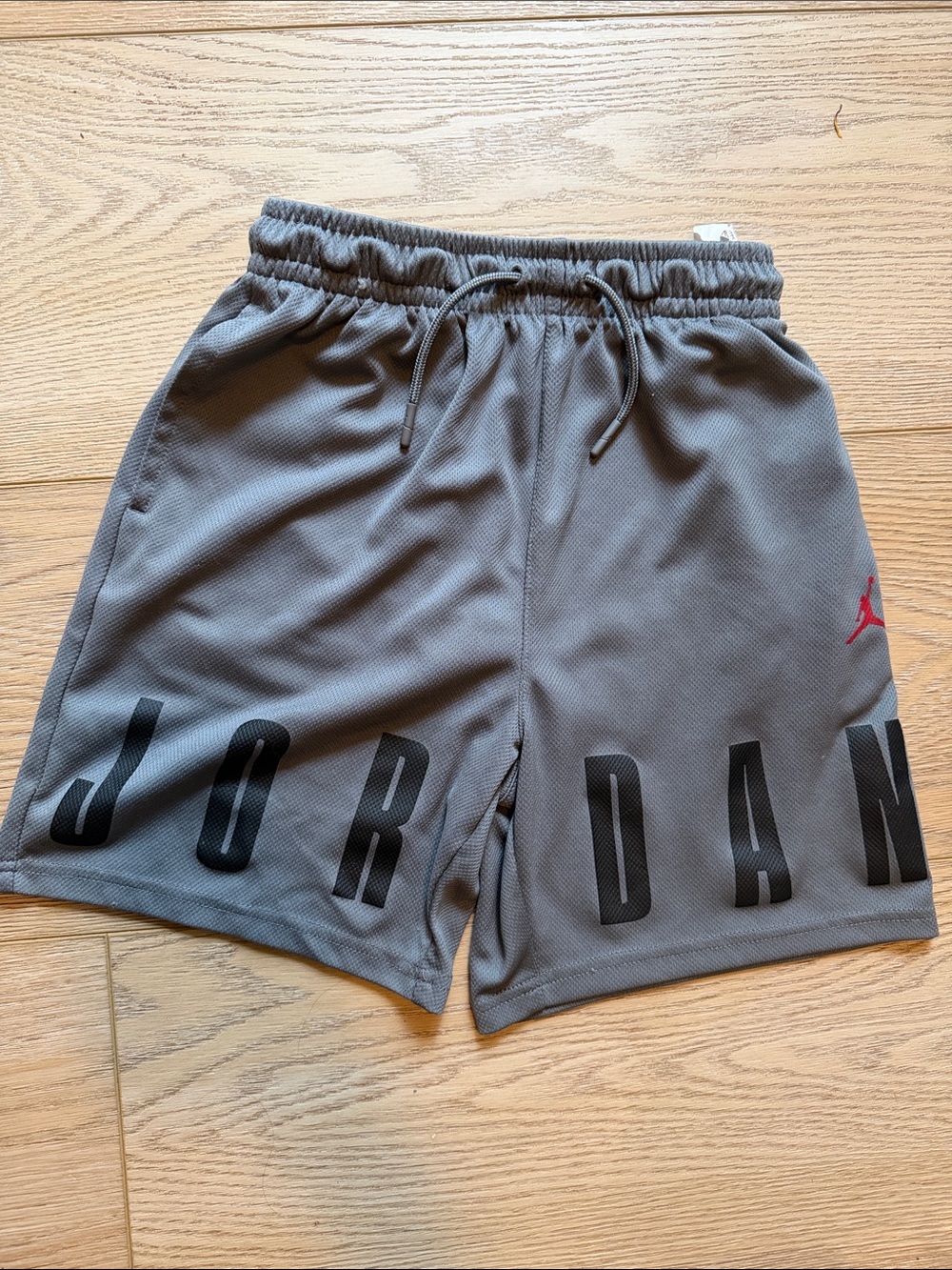 Jordan boys Gray Athletic Shorts with Black Lettering and Red Jumpman